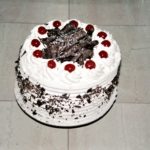 This classic Black Forest Cake recipe calls for soaking each of the four chocolate layers with Kirsch (cherry brandy). 