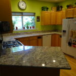 Finished countertop with new sink, but the faucet, disposal, and drains still need to be installed.              