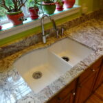 Finished countertop with new sink, faucet, and soap dispenser.